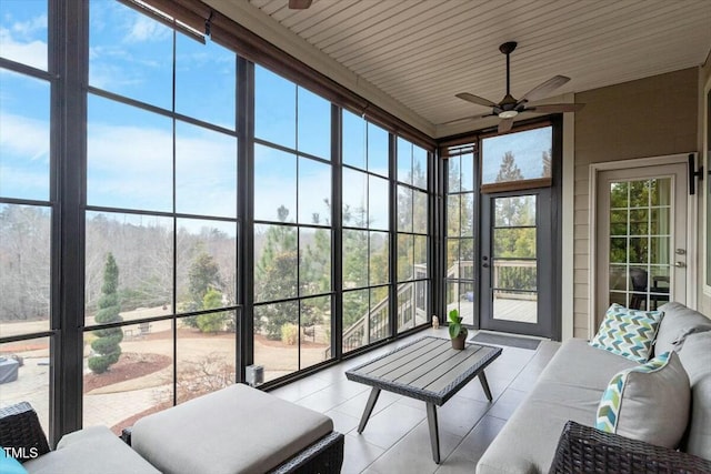 sunroom / solarium with ceiling fan