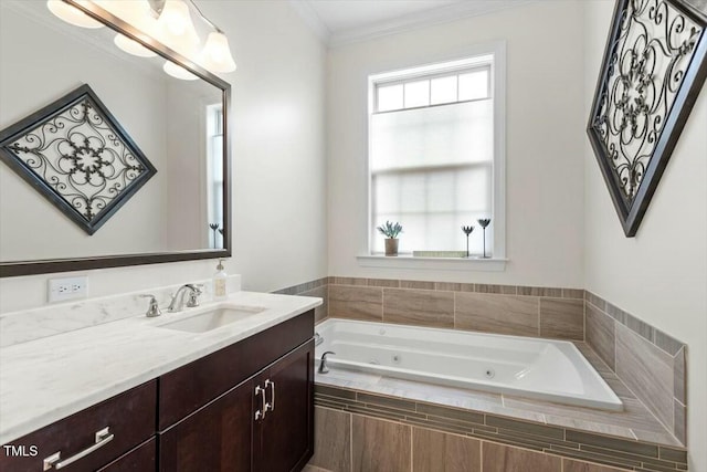 full bathroom featuring a wealth of natural light, a jetted tub, vanity, and ornamental molding