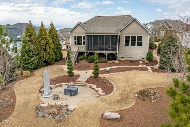 back of property featuring stairway, an outdoor fire pit, a sunroom, crawl space, and a patio