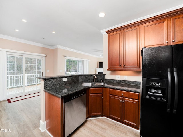 kitchen featuring stainless steel dishwasher, ornamental molding, black fridge with ice dispenser, and a sink