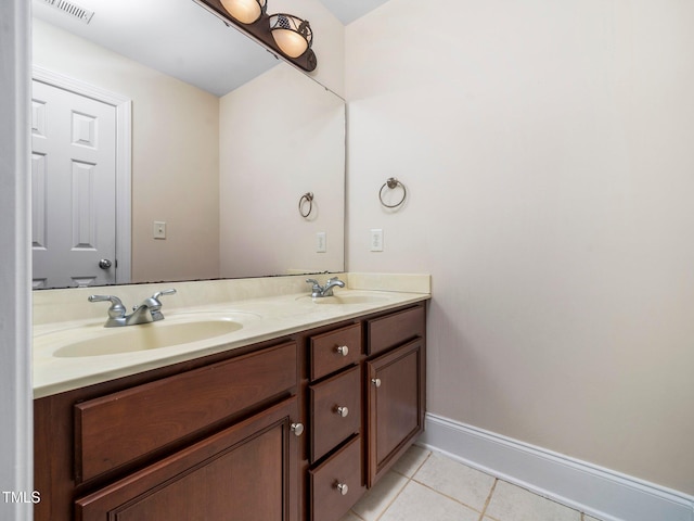 bathroom with tile patterned floors, double vanity, visible vents, and a sink