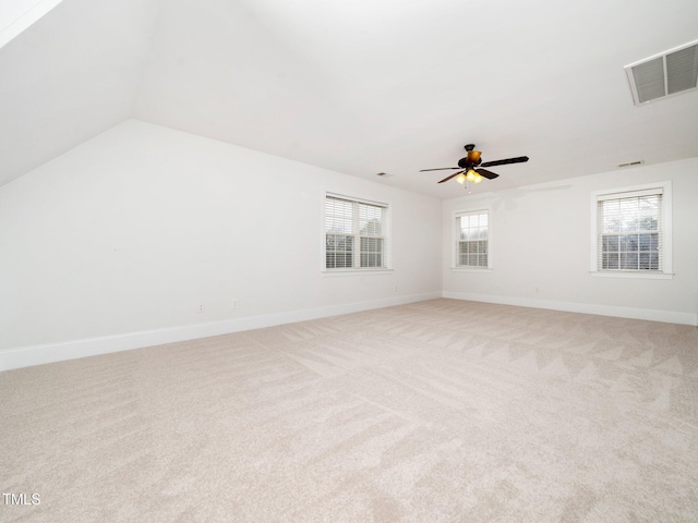 unfurnished room featuring light carpet, visible vents, and baseboards