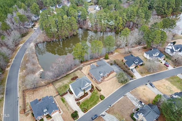 birds eye view of property featuring a residential view and a water view