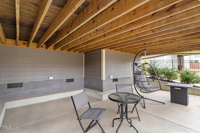 view of patio featuring fence