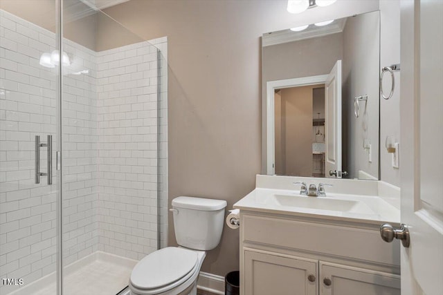 bathroom featuring vanity, toilet, and a shower stall