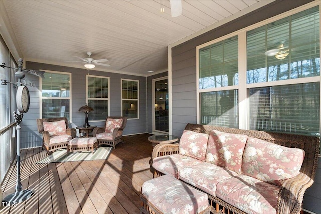 wooden terrace with a ceiling fan