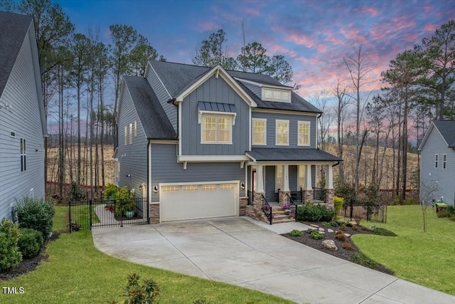 craftsman-style house with board and batten siding, a porch, a front yard, a garage, and stone siding