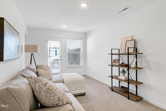 living area featuring recessed lighting, visible vents, carpet flooring, and baseboards