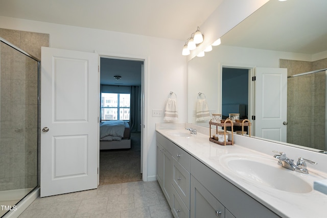 full bathroom with a tile shower, connected bathroom, and a sink