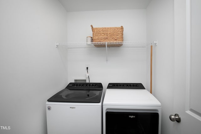 laundry area with laundry area and independent washer and dryer