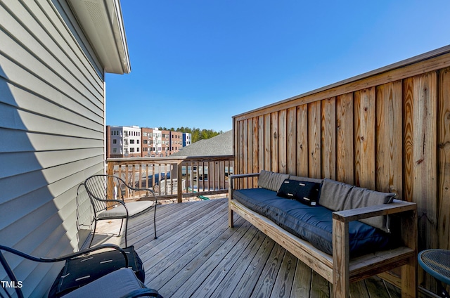 wooden terrace featuring an outdoor hangout area