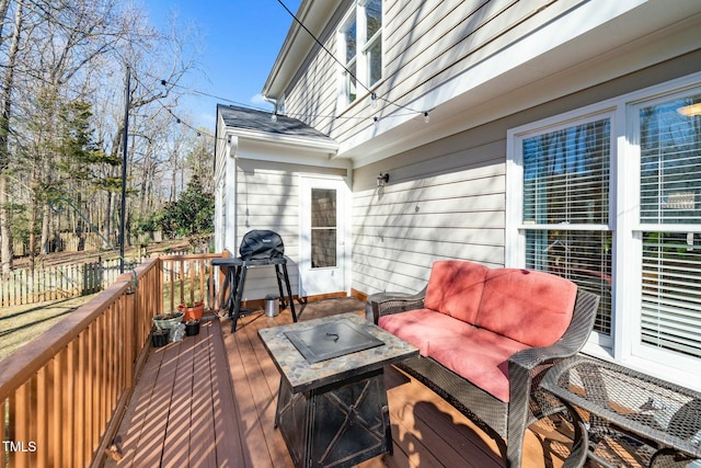 deck featuring area for grilling and outdoor lounge area