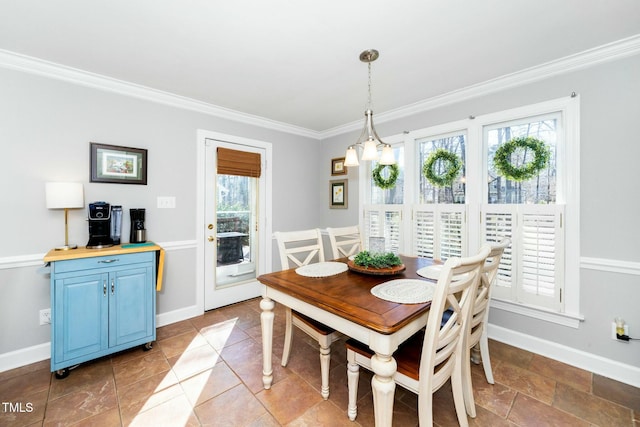 dining space featuring baseboards and ornamental molding