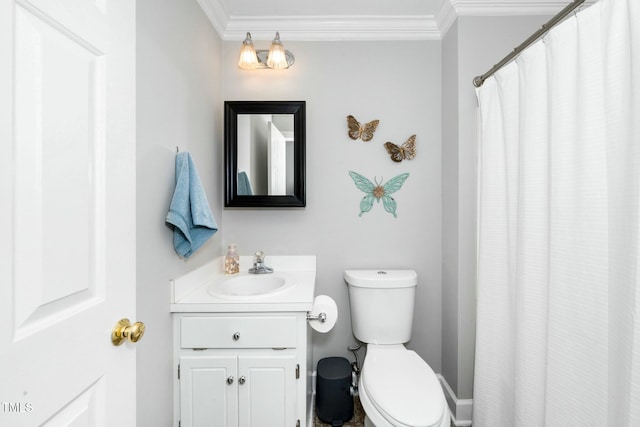 bathroom featuring toilet, ornamental molding, and vanity