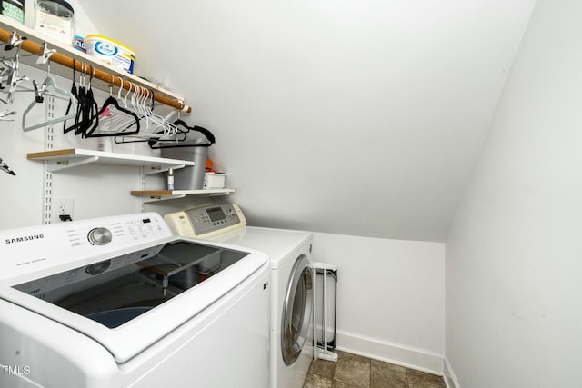 laundry area with stone finish flooring, baseboards, independent washer and dryer, and laundry area