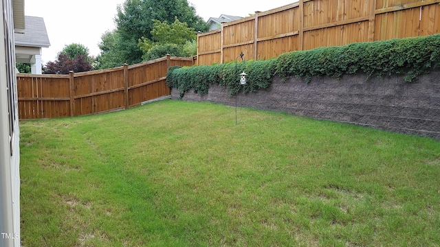 view of yard with a fenced backyard