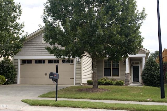 obstructed view of property featuring concrete driveway, an attached garage, and a front yard