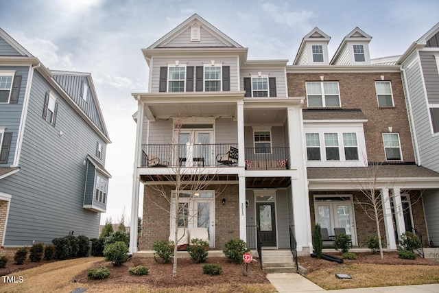 multi unit property with brick siding and french doors