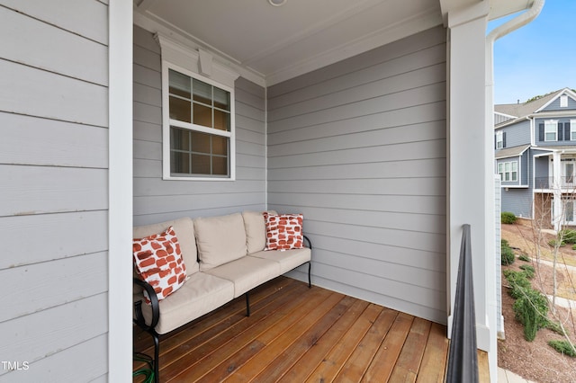 wooden terrace with outdoor lounge area