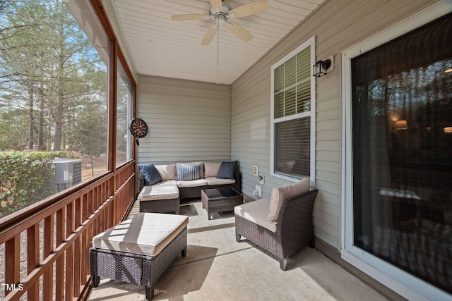 sunroom with a ceiling fan