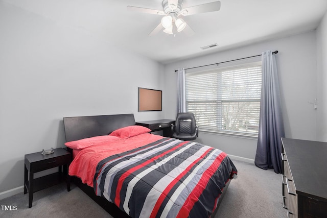 carpeted bedroom with visible vents, ceiling fan, and baseboards