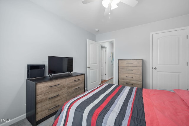 bedroom with carpet flooring, baseboards, and ceiling fan