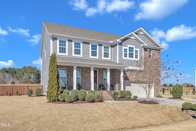 view of front facade with fence, driveway, a porch, an attached garage, and brick siding