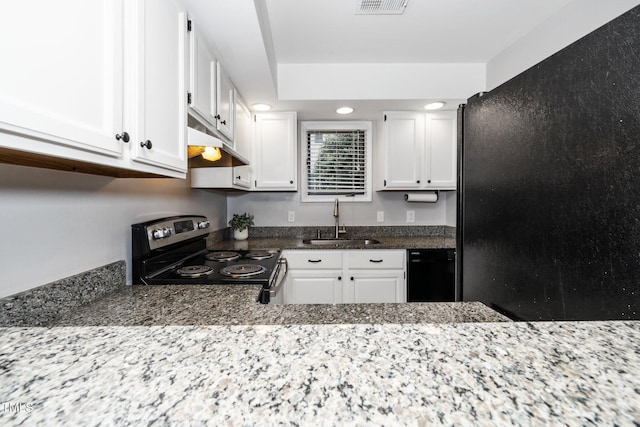 kitchen featuring a sink, white cabinetry, black appliances, and under cabinet range hood