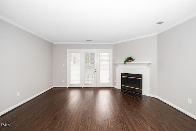 unfurnished living room featuring a fireplace, dark wood-type flooring, baseboards, and crown molding