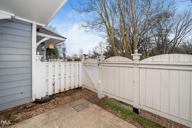 view of patio / terrace featuring fence and a gate