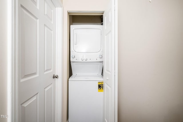 laundry area featuring laundry area and stacked washer and dryer