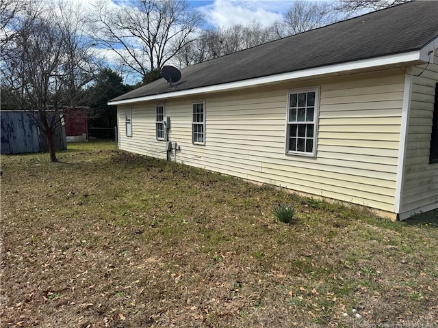 view of property exterior featuring a yard