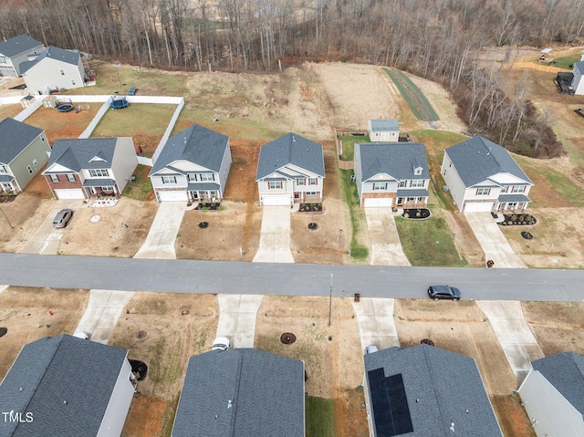 birds eye view of property with a residential view