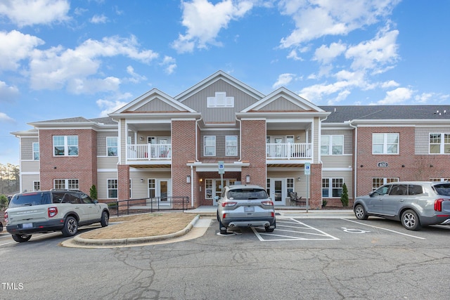 view of building exterior with uncovered parking