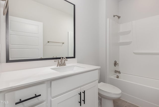 bathroom with tile patterned flooring, toilet, vanity, and  shower combination