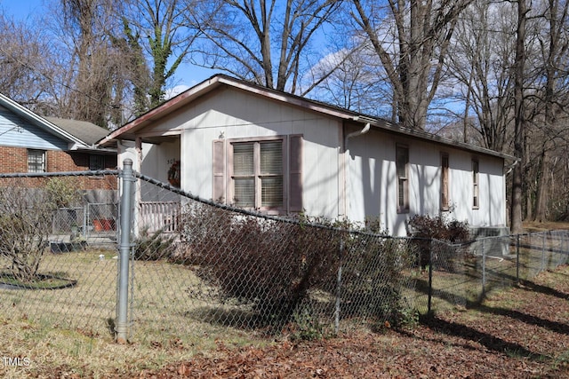 view of side of home with a fenced front yard