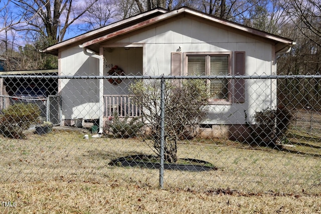 view of side of home with crawl space and fence