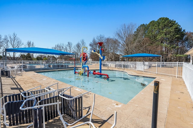 pool featuring a patio area and fence