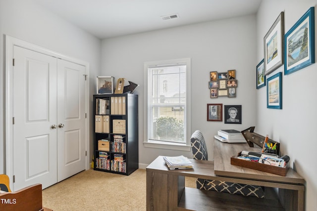 carpeted home office with visible vents