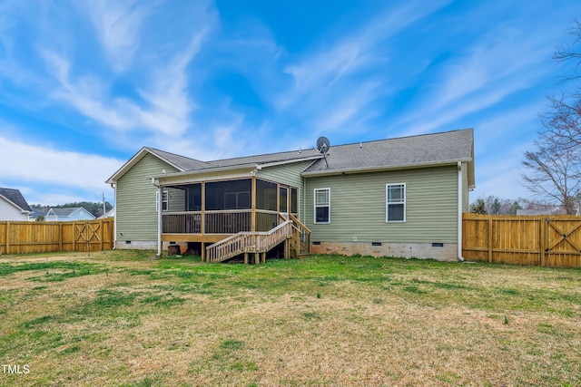 rear view of property with crawl space, a fenced backyard, a yard, and a sunroom