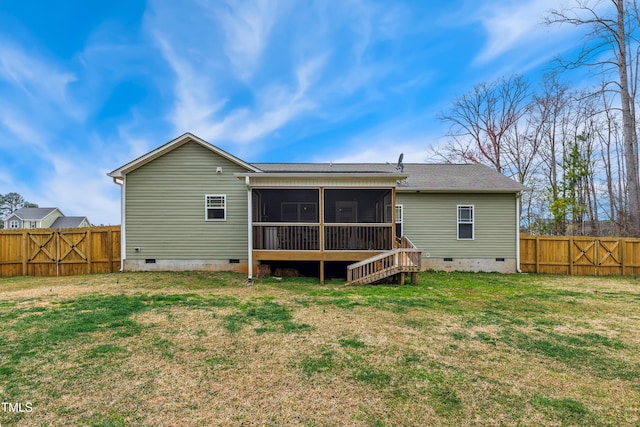 back of house with fence, a lawn, a sunroom, and crawl space