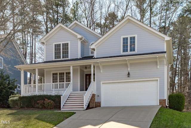 view of front of property with an attached garage, a porch, and driveway