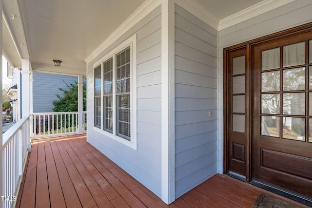 wooden deck featuring covered porch