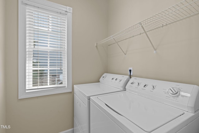 laundry area featuring laundry area and washer and clothes dryer