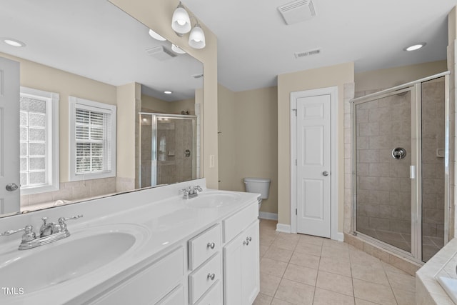 bathroom with tile patterned floors, visible vents, a shower stall, and a sink