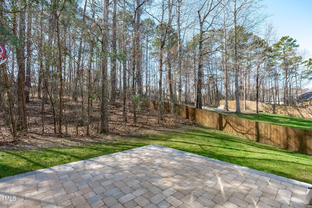 view of patio / terrace featuring fence