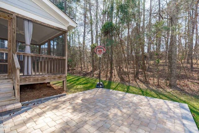 view of patio / terrace with a sunroom