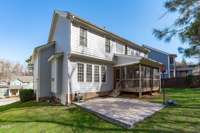 rear view of house featuring a lawn, fence, a sunroom, crawl space, and a patio area