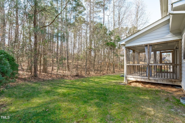 view of yard with a sunroom