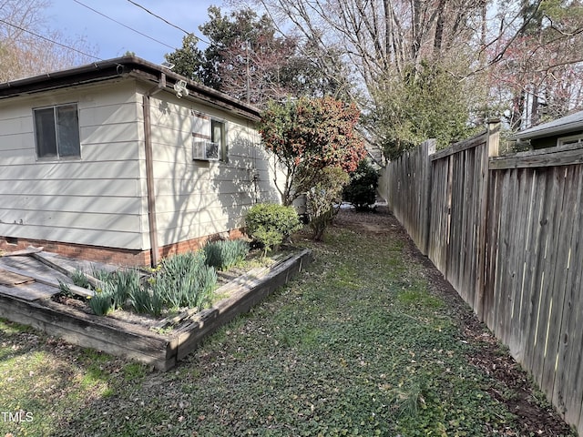 view of home's exterior with fence